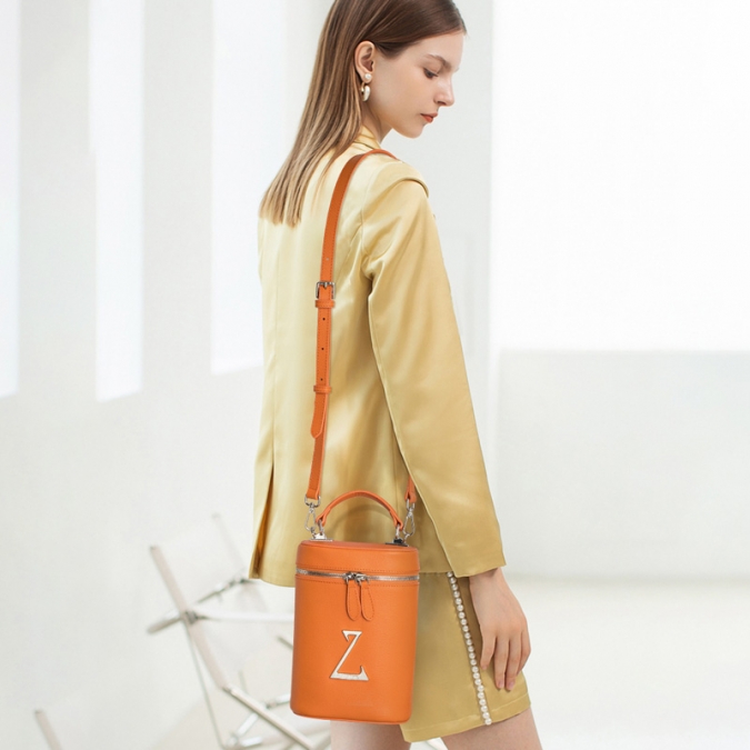 2021 orangefarbene Echtleder Bucket Bag für Damen mit individuellem Logo 